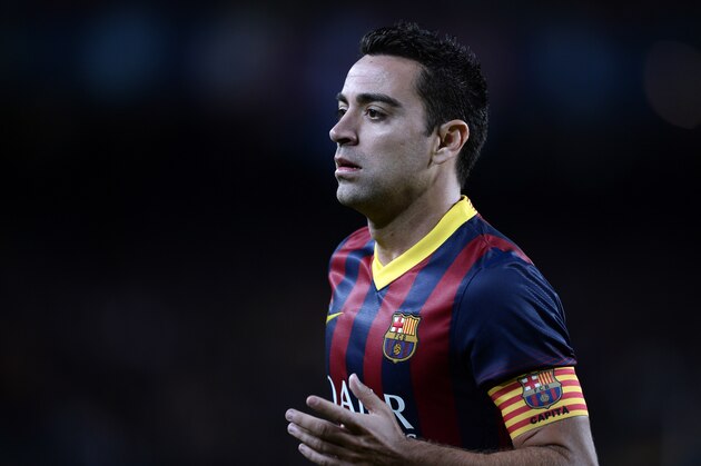 FC Barcelona's Xavi Hernandez in action against Espanyol during a Spanish La Liga soccer match at the Camp Nou stadium in Barcelona, Spain, Friday, Nov. 1, 2013. (AP Photo/Manu Fernandez)