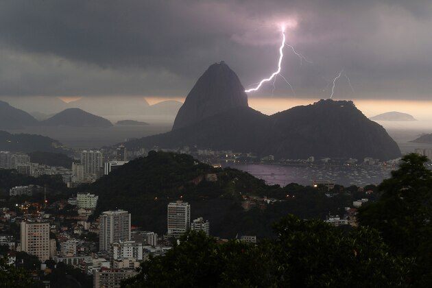 Lightning lights up the the sky over Sugar Loaf mountain in Rio de Janeiro, Brazil, Thursday, Jan.16, 2014. An alert was called by Rio authorities due to heavy rains and the possibilty of floods in the city. (AP Photo/Leo Correa)