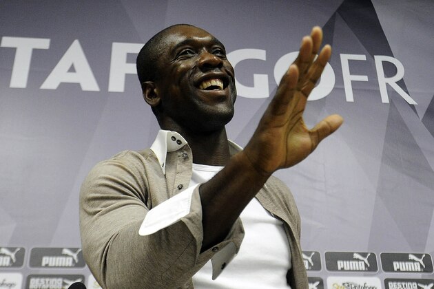 Dutch soccer player Clarence Seedorf gestures at a press conference at the Brazilian club Botafogo, where the midfielder has been playing in Rio de Janeiro, Brazil, Tuesday, Jan. 14, 2014.  Seedorf said Tuesday he will take over as the new coach at AC Milan, replacing Massimiliano Allegri who was fired the day before. (AP Photo/Fabio Castro, AGIF)