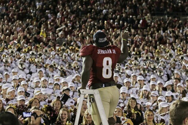 Florida State's Timmy Jernigan celebrates with fans after the NCAA BCS National Championship college football game against Auburn Monday, Jan. 6, 2014, in Pasadena, Calif. Florida State won 34-31. (AP Photo/Chris Carlson)