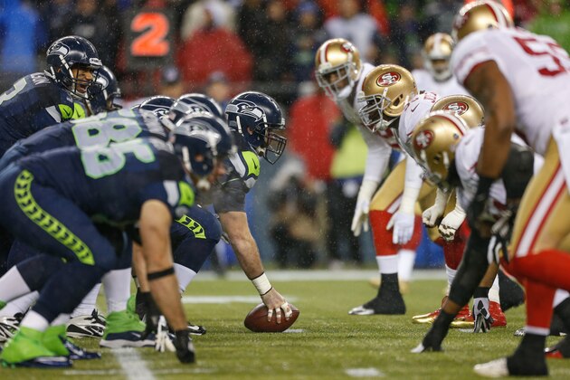 SEATTLE, WA - DECEMBER 23:  Quarterback Russell Wilson #3 of the Seattle Seahawks looks over the defense at the line of scrimmage during the game against the San Francisco 49ers at CenturyLink Field on December 23, 2012 in Seattle, Washington.  (Photo by Otto Greule Jr/Getty Images)