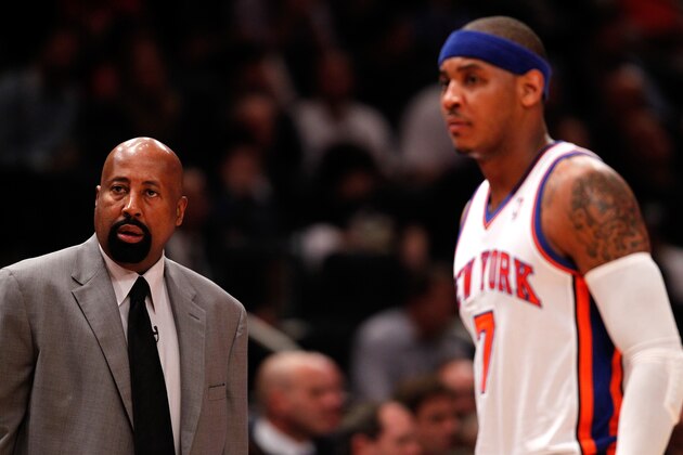 NEW YORK, NY - MAY 03:  (L-R) Head coach Mike Woodson and Carmelo Anthony #7 of the New York Knicks look on against the Miami Heat in Game Three of the Eastern Conference Quarterfinals in the 2012 NBA Playoffs on May 3, 2012 at Madison Square Garden in New York City.  NOTE TO USER: User expressly acknowledges and agrees that, by downloading and or using this photograph, User is consenting to the terms and conditions of the Getty Images License Agreement.  (Photo by Jeff Zelevansky/Getty Images)