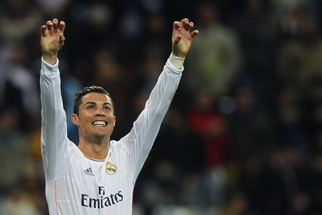 FILE - The Jan. 6, 2013 file photo shows Real Madrid's Cristiano Ronaldo from Portugal celebrating his goal during a Spanish La Liga soccer match between Real Madrid and Celta at the Santiago Bernabeu stadium in Madrid. Ronaldo is one of the three candidates as the world's best soccer player  to be awarded at the FIFA Ballon d'Or gala on Monday, Jan 13, 2014. (AP Photo/Andres Kudacki)