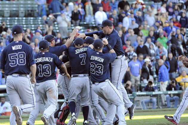 CHICAGO, IL - SEPTEMBER 22: The Atlanta Braves celebrate their division championship on September 22, 2013 at Wrigley Field in Chicago, Illinois. The Atlanta Braves defeated the Chicago Cubs 5-2 to clinch the National League East Championship.  (Photo by David Banks/Getty Images)
