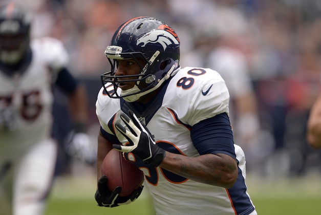 Dec 22, 2013; Houston, TX, USA; Denver Broncos tight end Julius Thomas (80) runs after a catch against the Houston Texans during the first half at Reliant Stadium. Mandatory Credit: Thomas Campbell-USA TODAY Sports