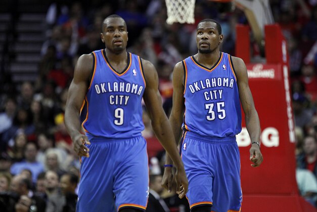 Jan 16, 2014; Houston, TX, USA; Oklahoma City Thunder power forward Serge Ibaka (9) and small forward Kevin Durant (35) walk on the court during the fourth quarter against the Houston Rockets at Toyota Center. Mandatory Credit: Andrew Richardson-USA TODAY Sports