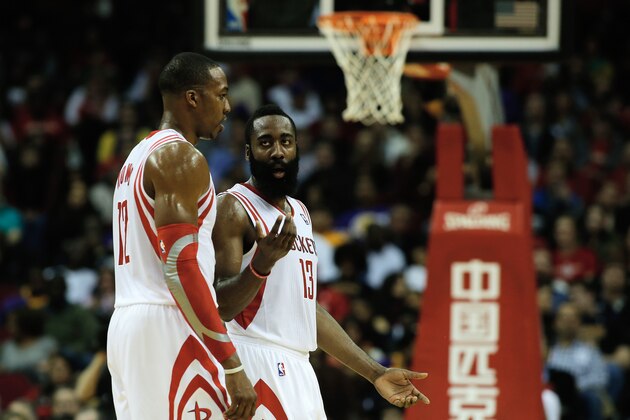 HOUSTON, TX - JANUARY 8:  Dwight Howard #12 and James Harden #13 of the Houston Rockets walk across the court during the game against the Los Angeles Lakers at the Toyota Center on January 8, 2014 in Houston, Texas. NOTE TO USER: User expressly acknowledges and agrees that, by downloading and or using this photograph, User is consenting to the terms and conditions of the Getty Images License Agreement. (Photo by Scott Halleran/Getty Images)