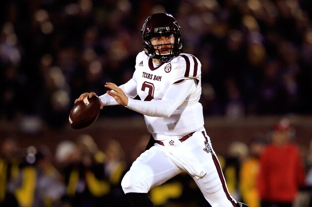 COLUMBIA, MO - NOVEMBER 30:  Quarterback Johnny Manziel #2 of the Texas A&M Aggies scrambles during the game against the Missouri Tigers on November 30, 2013 in Columbia, Missouri.  (Photo by Jamie Squire/Getty Images)