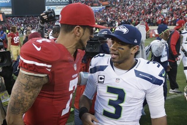 FILE - In this Dec. 8, 2013, file photo, San Francisco 49ers quarterback Colin Kaepernick, left, talks with Seattle Seahawks quarterback Russell Wilson (3) after an NFL football game in San Francisco. The 49ers beat the Seahawks 19-17. The Seahawks host the 49ers in the NFC championship on Sunday. (AP Photo/Marcio Jose Sanchez) FILE - In this Dec. 8, 2013, file photo, San Francisco 49ers quarterback Colin Kaepernick, left, talks with Seattle Seahawks quarterback Russell Wilson (3) after an NFL football game in San Francisco. The 49ers beat the Seahawks 19-17. The Seahawks host the 49ers in the NFC championship on Sunday. (AP Photo/Marcio Jose Sanchez)