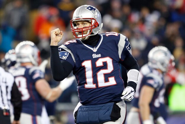 Nov 24, 2013; Foxborough, MA, USA; New England Patriots quarterback Tom Brady (12) makes a fist pump after a pass against the Denver Broncos in the first quarter at Gillette Stadium. Mandatory Credit: David Butler II-USA TODAY Sports