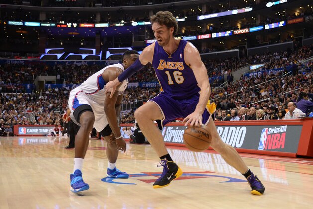 LOS ANGELES, CA - JANUARY 10: Pau Gasol #16 of the Los Angeles Lakers drives to the basket during a game against the Los Angeles Clippers at STAPLES Center on January 10, 2014 in Los Angeles, California. NOTE TO USER: User expressly acknowledges and agrees that, by downloading and/or using this Photograph, user is consenting to the terms and conditions of the Getty Images License Agreement. Mandatory Copyright Notice: Copyright 2014 NBAE (Photo by Noah Graham/NBAE via Getty Images)
