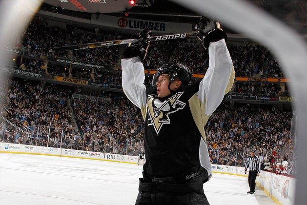 PITTSBURGH, PA - JANUARY 15:  Olli Maatta #3 of the Pittsburgh Penguins celebrates his game-winning goal during the third period against the Washington Capitals on January 15, 2014 at Consol Energy Center in Pittsburgh, Pennsylvania.  (Photo by Gregory Shamus/NHLI via Getty Images)