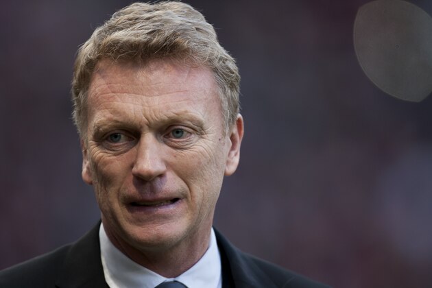 Manchester United's manager David Moyes takes to the touchline before his team's English Premier League soccer match against West Ham United at Old Trafford Stadium, Manchester, England, Saturday Dec. 21, 2013. (AP Photo/Jon Super)