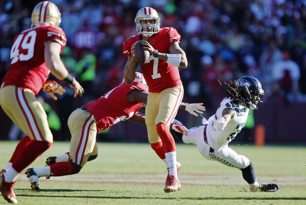 SAN FRANCISCO, CA - DECEMBER 08: Quarterback Colin Kaepernick #7 of the San Francisco 49ers looks for wide receiver Michael Crabtree as he steps out of the way of cornerback Richard Sherman #25 of the Seattle Seahawks in the second quarter on December 8, 2013 at Candlestick Park in San Francisco, California. The 49ers won 19-17. (Photo by Brian Bahr/Getty Images) SAN FRANCISCO, CA - DECEMBER 08: Quarterback Colin Kaepernick #7 of the San Francisco 49ers looks for wide receiver Michael Crabtree as he steps out of the way of cornerback Richard Sherman #25 of the Seattle Seahawks in the second quarter on December 8, 2013 at Candlestick Park in San Francisco, California. The 49ers won 19-17. (Photo by Brian Bahr/Getty Images)