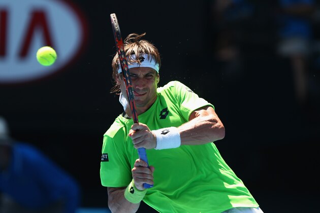MELBOURNE, AUSTRALIA - JANUARY 17:  David Ferrer of Spain plays a backhand in his third round match against Jeremy Chardy of France during day five of the 2014 Australian Open at Melbourne Park on January 17, 2014 in Melbourne, Australia.  (Photo by Ryan Pierse/Getty Images)