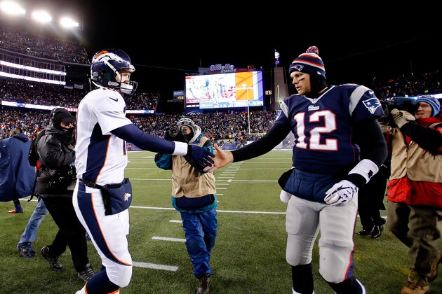 FOXBORO, MA - NOVEMBER 24: Quarterback Peyton Manning #18 of the Denver Broncos and quarterback Tom Brady #12 of the New England Patriots shake hands after the New England Patriots defeated the Denver Broncos 34-31 in overtime at Gillette Stadium on November 24, 2013 in Foxboro, Massachusetts.  (Photo by Jim Rogash/Getty Images)