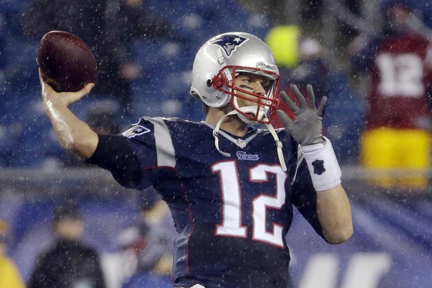 New England Patriots quarterback Tom Brady warms up before an AFC divisional NFL playoff football game against the Indianapolis Colts in Foxborough, Mass., Saturday, Jan. 11, 2014. (AP Photo/Matt Slocum)