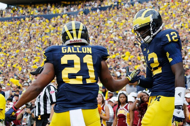 ANN ARBOR, MI - AUGUST 31: Devin Gardner #12 of the Michigan Wolverines celebrates a first quarter touchdown with Jeremy Gallon #21 while playing the Central Michigan Chippewas at Michigan Stadium on August 31, 2013 in Ann Arbor, Michigan.  (Photo by Gregory Shamus/Getty Images)