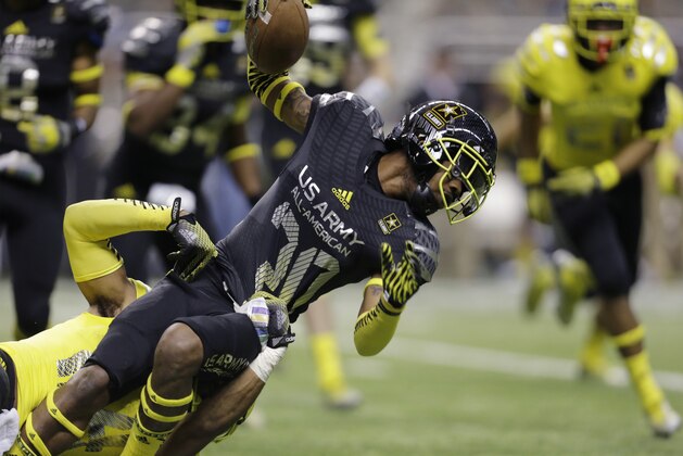 U.S. Army All-American East's Myles Autry (20) is stopped during the U.S. Army All-American Bowl football game, Saturday, Jan. 4, 2014, in San Antonio. (AP Photo/Eric Gay)