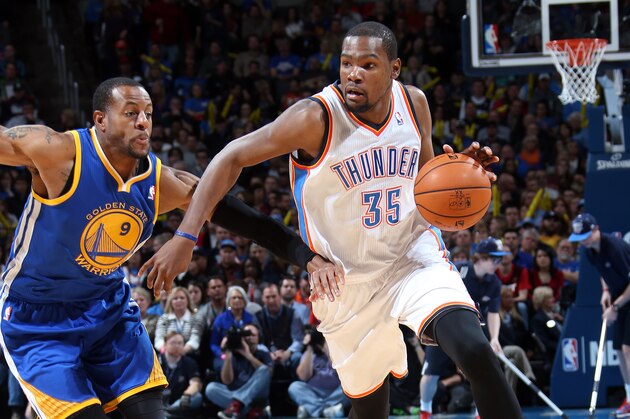 OKLAHOMA CITY, OK - JANUARY 17: Kevin Durant #35 of the Oklahoma City Thunder moves past Andre Iguodala #9 of the Golden State Warriors during an NBA game on January 17, 2014 at the Chesapeake Energy Arena in Oklahoma City, Oklahoma. NOTE TO USER: User expressly acknowledges and agrees that, by downloading and or using this Photograph, user is consenting to the terms and conditions of the Getty Images License Agreement. Mandatory Copyright Notice: Copyright 2014 NBAE (Photo by Layne Murdoch/NBAE via Getty Images)