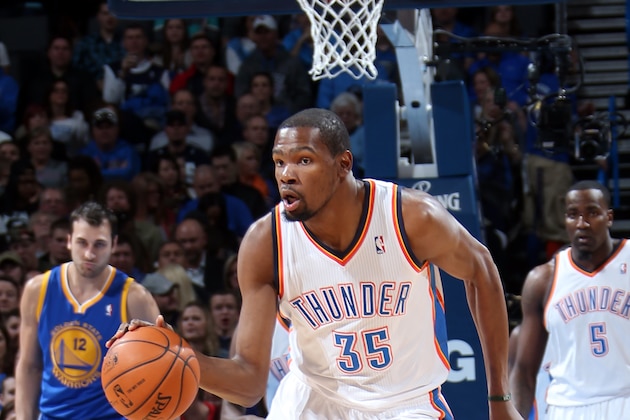 OKLAHOMA CITY, OK - JANUARY 17: Kevin Durant #35 of the Oklahoma City Thunder moves the ball down the court during an NBA game on January 17, 2014 at the Chesapeake Energy Arena in Oklahoma City, Oklahoma. NOTE TO USER: User expressly acknowledges and agrees that, by downloading and or using this Photograph, user is consenting to the terms and conditions of the Getty Images License Agreement. Mandatory Copyright Notice: Copyright 2014 NBAE (Photo by Layne Murdoch/NBAE via Getty Images)