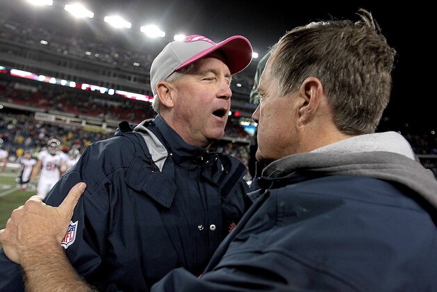 FOXBORO, MA - OCTOBER 7:  John Fox (L), head coach of the Denver Broncos, speaks with Bill Belichick, head coach of the New England Patriots, after their game at Gillette Stadium on October 7, 2012 in Foxboro, Massachusetts. (Photo by Jim Rogash/Getty Images)
