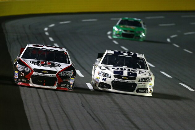 CONCORD, NC - OCTOBER 12:  Kevin Harvick, driver of the #29 Jimmy John's Chevrolet, and Jimmie Johnson, driver of the #48 Lowe's Dover White Chevrolet, race ahead of Kasey Kahne, driver of the #5 Quaker State Chevrolet, during the NASCAR Sprint Cup Series Bank of America 500 at Charlotte Motor Speedway on October 12, 2013 in Concord, North Carolina.  (Photo by Jonathan Ferrey/Getty Images)