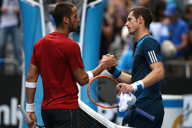 Andy Murray of Britain, right, shakes hands with Feliciano Lopez of Spain at the net after Murray won their third round match at the Australian Open tennis championship in Melbourne, Australia, Saturday, Jan. 18, 2014.(AP Photo/Rick Rycroft)