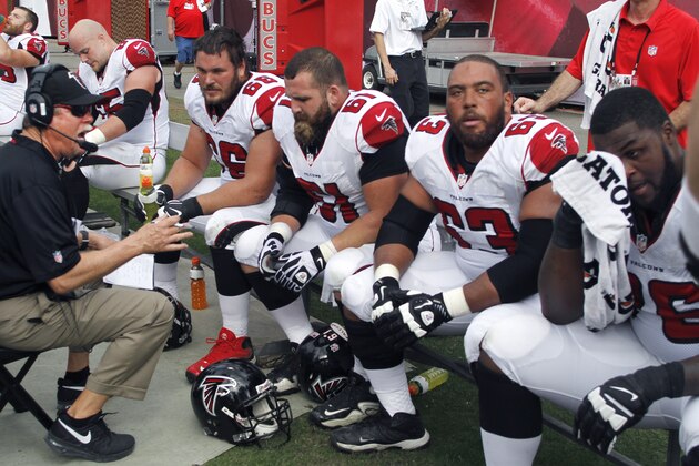 Atlanta Falcons offensive line on the sidelines during the first half of an NFL football game on Sunday,  Nov.  17, 2013 in Tampa, Fla.. The Buccaneers beat the Falcons 41-28. (AP Photo/Reinhold Matay)