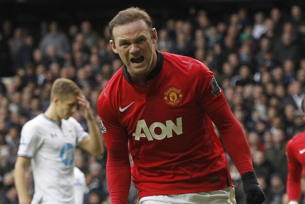 Manchester United's Wayne Rooney celebrates his penalty goal against Tottenham Hotspur during their English Premier League soccer match at White Hart Lane, London, Sunday, Dec. 1, 2013. (AP Photo/Sang Tan)