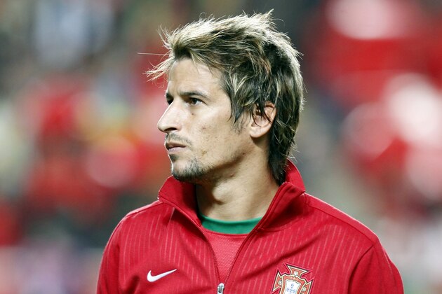 Portugal's Fabio Coentrao listens to the national anthems prior to a 2014 World Cup first leg qualifying playoff soccer match between Portugal and Sweden at the Luz stadium in Lisbon, Portugal, Friday, Nov. 15, 2013. (AP Photo/Francisco Seco)