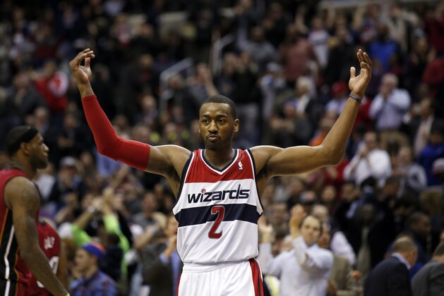 Washington Wizards guard John Wall (2) celebrates in the second half of an NBA basketball game against the Miami Heat, Wednesday, Jan. 15, 2014, in Washington. The Wizards won 114-97. (AP Photo/Alex Brandon) Washington Wizards guard John Wall (2) celebrates in the second half of an NBA basketball game against the Miami Heat, Wednesday, Jan. 15, 2014, in Washington. The Wizards won 114-97. (AP Photo/Alex Brandon)