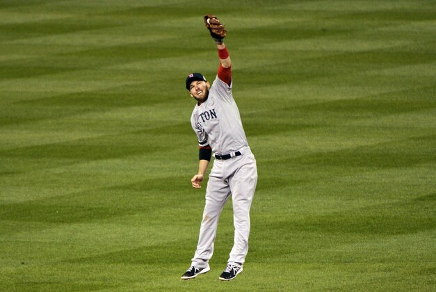 Oct 28, 2013; St. Louis, MO, USA; Boston Red Sox shortstop Stephen Drew (7) catches a line drive by St. Louis Cardinals catcher Yadier Molina (not pictured) during the fourth inning of game five of the MLB baseball World Series at Busch Stadium. Mandatory Credit: Rob Grabowski-USA TODAY Sports