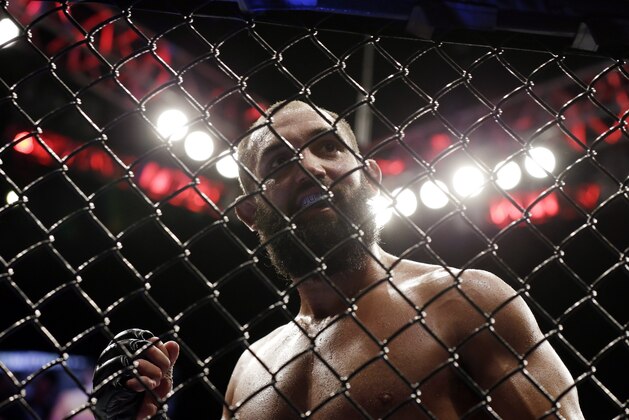 Johny Hendricks walks to his corner during a UFC 167 mixed martial arts championship against welterweight bout against Georges St. Pierre, of Canada, on Saturday, Nov. 16, 2013, in Las Vegas. St. Pierre won by split decision. (AP Photo/Isaac Brekken)