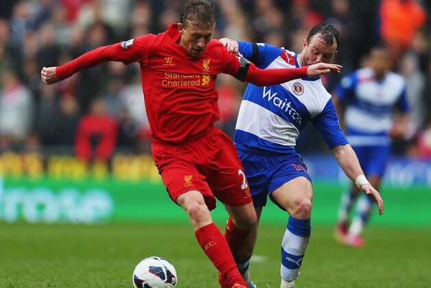 READING, ENGLAND - APRIL 13:  Lucas Leiva of Liverpool battles with Noel Hunt of Reading during the Barclays Premier League match between Reading and Liverpool at the Madejski Stadium on April 13, 2013 in Reading, England.  (Photo by Bryn Lennon/Getty Images)