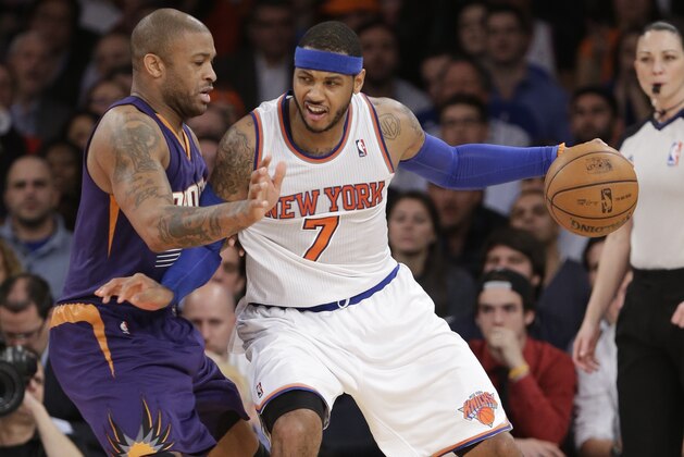 New York Knicks' Carmelo Anthony (7) is defended by Phoenix Suns' P.J. Tucker (17) during the overtime period of an NBA basketball game Monday, Jan. 13, 2014, in New York. The Knicks won the game 98-96. (AP Photo/Frank Franklin II) New York Knicks' Carmelo Anthony (7) is defended by Phoenix Suns' P.J. Tucker (17) during the overtime period of an NBA basketball game Monday, Jan. 13, 2014, in New York. The Knicks won the game 98-96. (AP Photo/Frank Franklin II)
