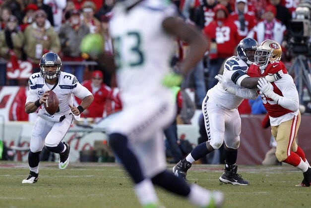 Dec 8, 2013; San Francisco, CA, USA; Seattle Seahawks quarterback Russell Wilson (3) looks to throw a pass against the San Francisco 49ers in the third quarter at Candlestick Park. The 49ers defeated the Seahawks 19-17. Mandatory Credit: Cary Edmondson-USA TODAY Sports