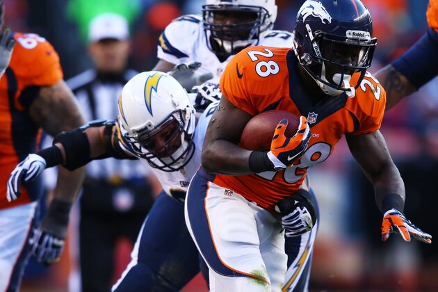 DENVER, CO - JANUARY 12:  Montee Ball #28 of the Denver Broncos tries to avoid the tackle of  Jarret Johnson #96 of the San Diego Chargers during the AFC Divisional Playoff Game at Sports Authority Field at Mile High on January 12, 2014 in Denver, Colorado.  (Photo by Doug Pensinger/Getty Images)