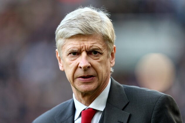 Arsenal's manager Arsene Wenger looks on ahead of their English Premier League soccer match against Newcastle United at St James' Park, Newcastle, England, Sunday, Dec. 29, 2013. (AP Photo/Scott Heppell)