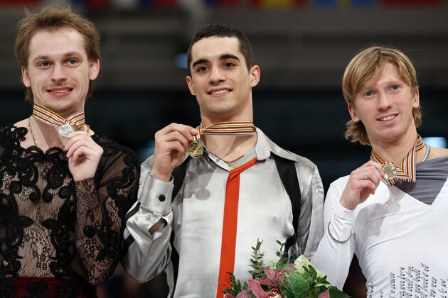 Gold medalist Spain's Javier Fernandez, center, silver medalist, Russia's Sergei Voronov, left, and bronze medalist Russia's Konstantin Menshow pose with their medals following the men's free skating during the European Figure Skating Championships, in Budapest, Hungary, Saturday, Jan. 18, 2014. (AP Photo/Darko Bandic)