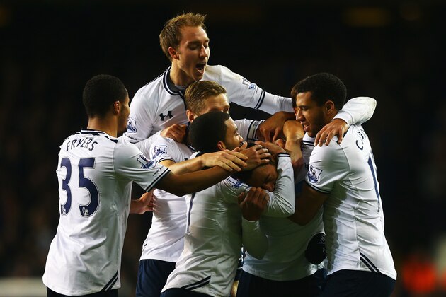 LONDON, ENGLAND - DECEMBER 29:  Mousa Dembele of Tottenham Hotspur is mobbed by team mates after scoring his team's second goal during the Barclays Premier League match between Tottenham Hotspur and Stoke City at White Hart Lane on December 29, 2013 in London, England.  (Photo by Paul Gilham/Getty Images)