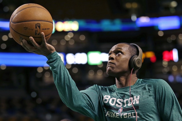 Boston Celtics guard Rajon Rondo wears headphones as he drives to the basket during a practice before an NBA basketball game against the Los Angeles Lakers, in Boston, Friday, Jan. 17, 2014. Celtics head coach Brad Stevens and general manager Danny Ainge both said Rondo would return for the game
