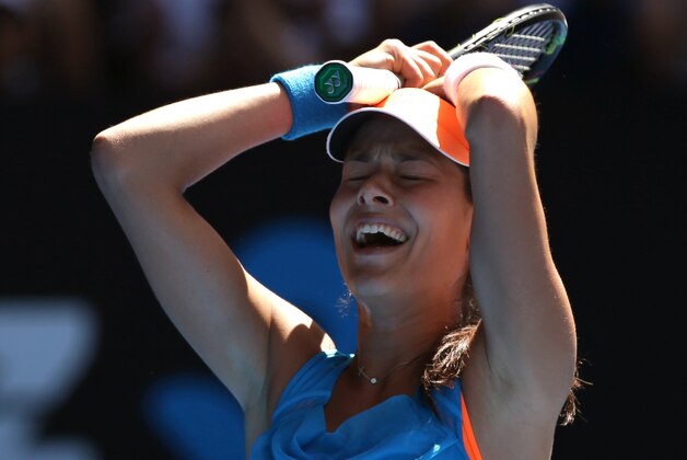 Ana Ivanovic of Serbia celebrates her win over Serena Williams of the U.S.  during their fourth round match at the Australian Open tennis championship in Melbourne, Australia, Sunday, Jan. 19, 2014.(AP Photo/Aaron Favila)