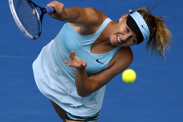 Maria Sharapova of Russia serves to Alize Cornet of France during their third round match at the Australian Open tennis championship in Melbourne, Australia, Saturday, Jan. 18, 2014.(AP Photo/Eugene Hoshiko)