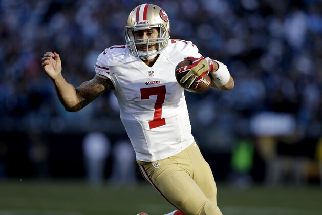 San Francisco 49ers quarterback Colin Kaepernick (7) carries the ball against the Carolina Panthers during the second half of a divisional playoff NFL football game, Sunday, Jan. 12, 2014, in Charlotte, N.C. (AP Photo/Gerry Broome)