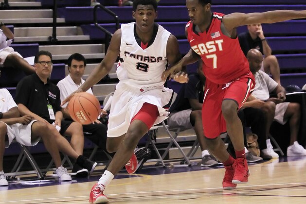 Jul 18, 2013; Washington, DC, USA; Team Canadaplayer Mantaque Caesar-Gill (8) dribbles the ball against Team USA East player Khadeen Carrington (7) during the Nike Global Challenge at Trinity University. Mandatory Credit: Geoff Burke-USA TODAY Sports