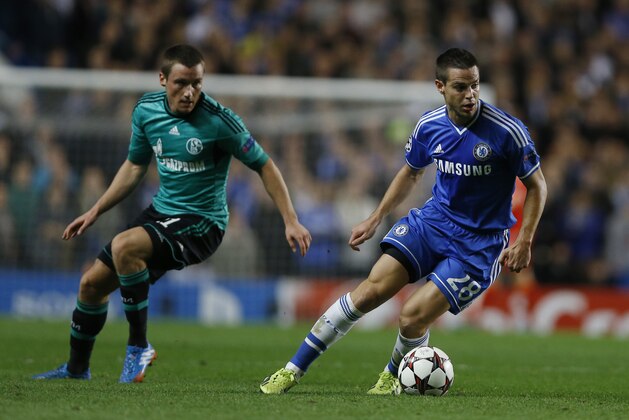 Chelsea's Cesar Azpilicueta, right, turns away from Schalke's Christian Clemens during the Champions League group E soccer match between Chelsea and FC Schalke 04 at Stamford Bridge Stadium  in London Wednesday, Nov. 6, 2013. (AP Photo/Kirsty Wigglesworth)