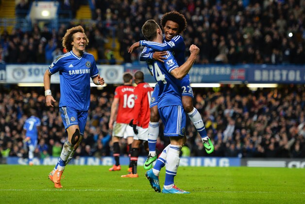 LONDON, ENGLAND - JANUARY 19:  Gary Cahill #24 of Chelsea celebrates with teammates after his cross lead to Samuel Eto'o of Chelsea scoring their team's second goal during the Barclays Premier League match between Chelsea and Manchester United at Stamford Bridge on January 19, 2014 in London, England.  (Photo by Shaun Botterill/Getty Images)