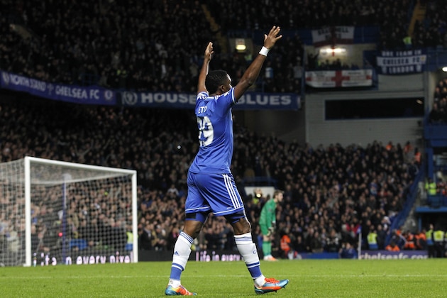 Chelsea's Samuel Eto'o celebrates after scoring his 3rd goal against Manchester United's during their English Premier League soccer match at Stamford Bridge, London, Sunday, Jan. 19, 2014. (AP Photo/Sang Tan)