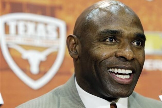 Charlie Strong answers questions during an NCAA college football news conference where he was introduced as the new Texas football coach, Monday, Jan. 6, 2014, in Austin, Texas. Strong acknowledged the historical significance of being the school's first African-American head coach of a men's sport. He takes over for Mack Brown, who stepped down last month after 16 seasons. (AP Photo/Eric Gay)